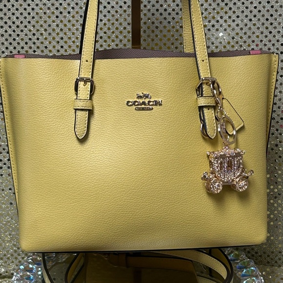 Coach Handbags - Coach Yellow Leather Tote with Charm and Gold Logo Approx. 13 x 8 x 3.5